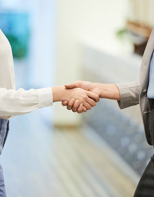 Partnership handshake for enhanced mission readiness.
